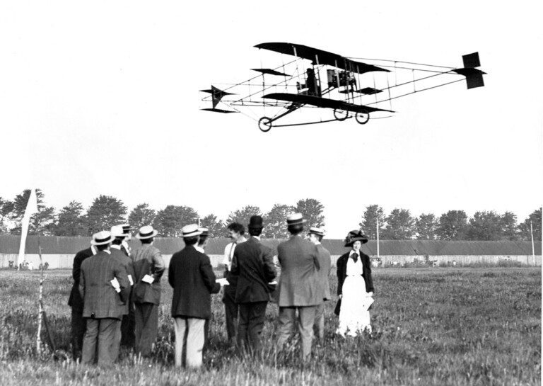 A formation of vintage fighter planes in the sky.