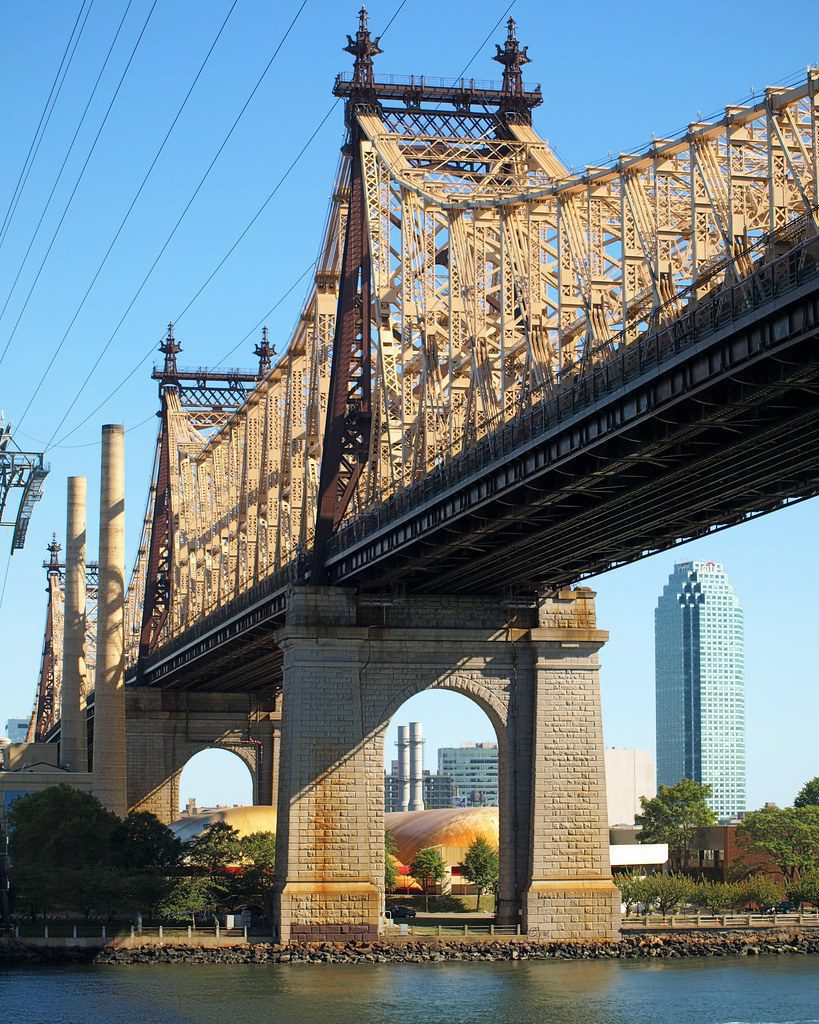 A view of the intricate steel truss work of the Queensboro Bridge.